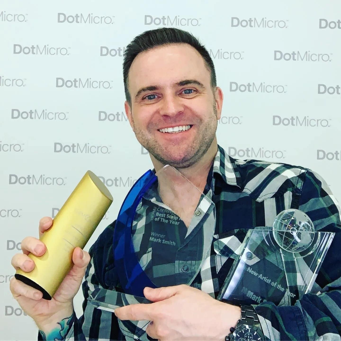 Scalp micropigmentation practitioner holding an industry award